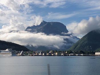 Scenic view of sea and buildings against sky