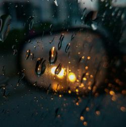 Close-up of raindrops on glass window