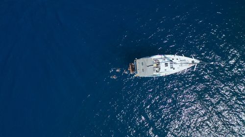 Top view of sail boat in the sea.