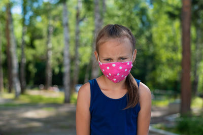 Portrait of girl standing outdoors