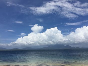 Scenic view of sea against cloudy sky