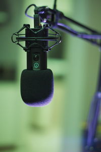 Close-up of electric lamp hanging on metal