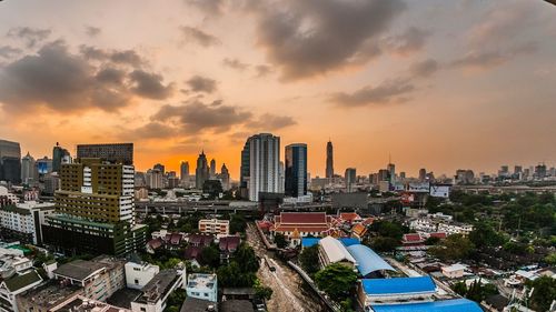 Cityscape against sky during sunset