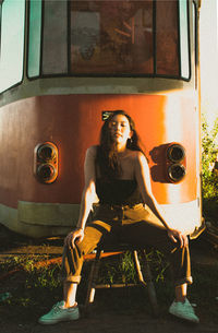 Rear view of woman sitting in train