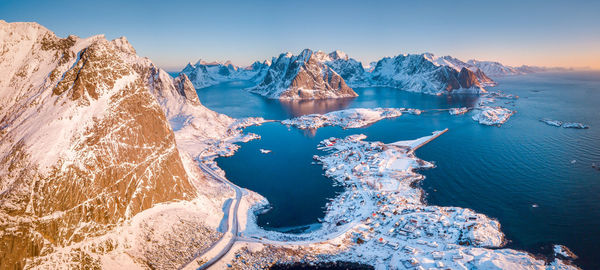 Scenic view of sea against clear sky during winter