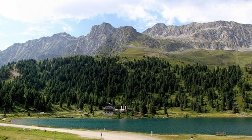 Scenic view of lake and mountains against sky