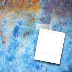 Close-up of paper on table against wall