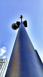 Low angle view of street light against sky