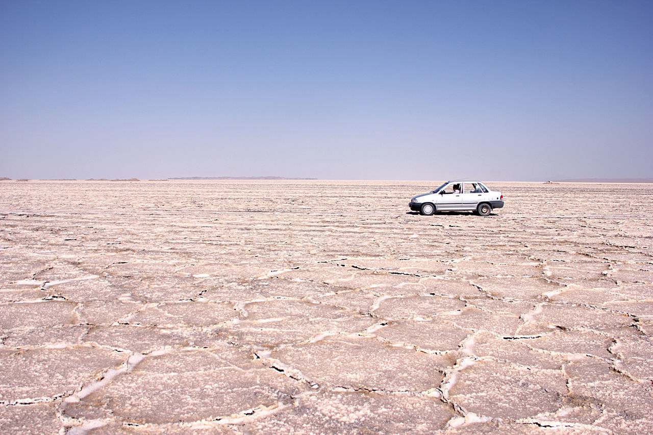 CAR ON DESERT LAND