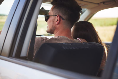 Portrait of man sitting in car