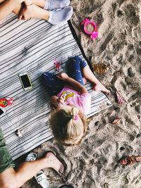 High angle view of woman lying down on floor