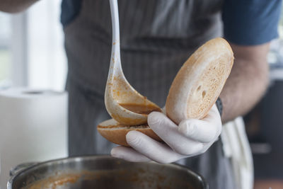 Close-up of person preparing food