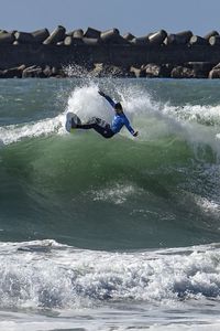 People surfing in sea