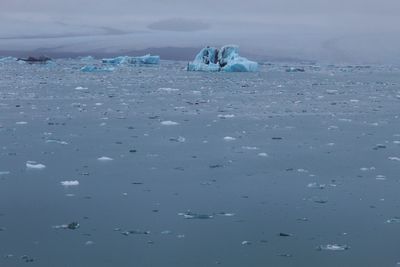 Scenic view of sea against sky during winter