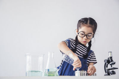 Girl looking at camera on table