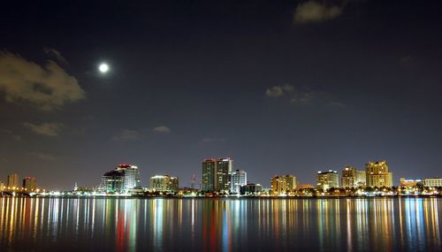 Illuminated city at waterfront