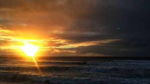 Scenic view of sea at sunset