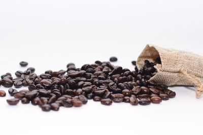 Close-up of coffee beans against white background