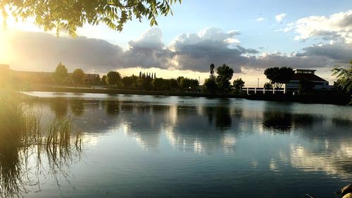 Scenic view of lake at sunset