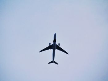 Low angle view of airplane flying in sky