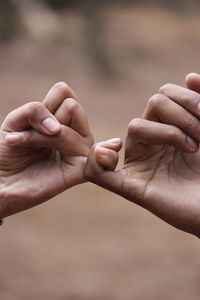 Close-up of people holding hands