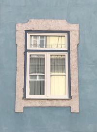 Low angle view of window on wall of building