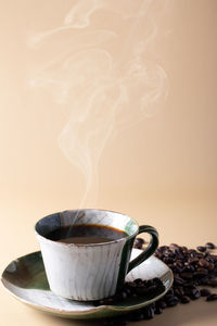 Close-up of coffee cup on table