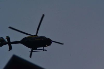 Low angle view of airplane against clear sky