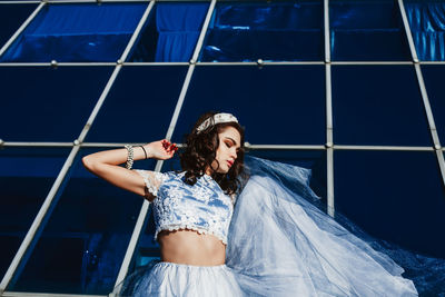 Low angle view of woman posing