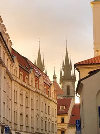 Low angle view of buildings in city against sky