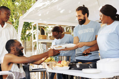 Side view of senior man preparing food at home