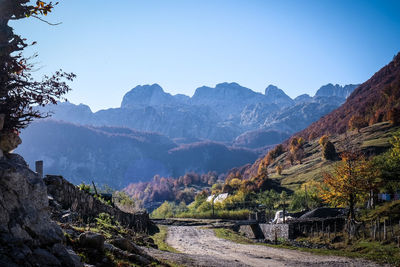Scenic view of mountains against clear blue sky