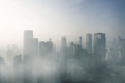 Modern buildings in city against sky