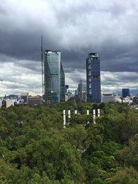 Buildings in city against sky