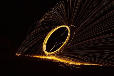 Light trails against sky at night