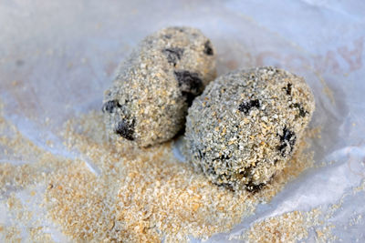 High angle view of cookies on sand