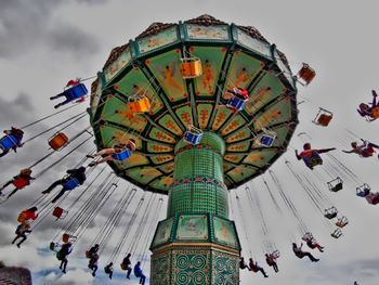 Low angle view of ferris wheel against sky