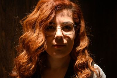 Close-up portrait of young woman with sunglasses