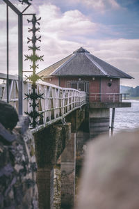 House by sea against sky