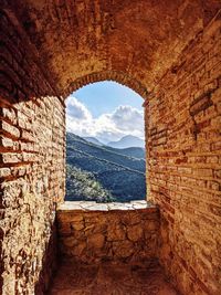 Scenic view of mountains seen through window