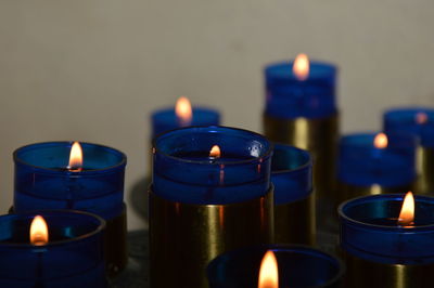 Zoom on blue candels in a small chuch