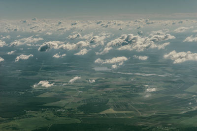 Aerial view of landscape and sea against sky