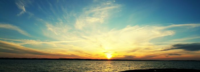 Scenic view of sea at sunset