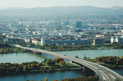 High angle view of river amidst buildings in city