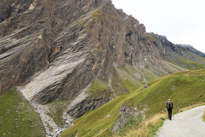 Rear view of woman on mountain road