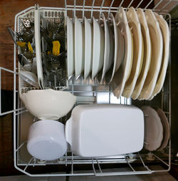 High angle view of washed utensils in dish rack