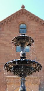 Low angle view of fountain against building