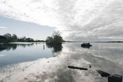 A group of tourists travel by zodiac boat on the columbia river in or.