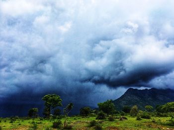 Scenic view of mountain against cloudy sky