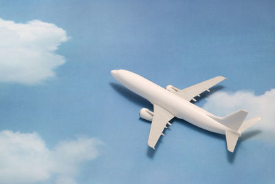 Close-up of model airplane on sky patterned table